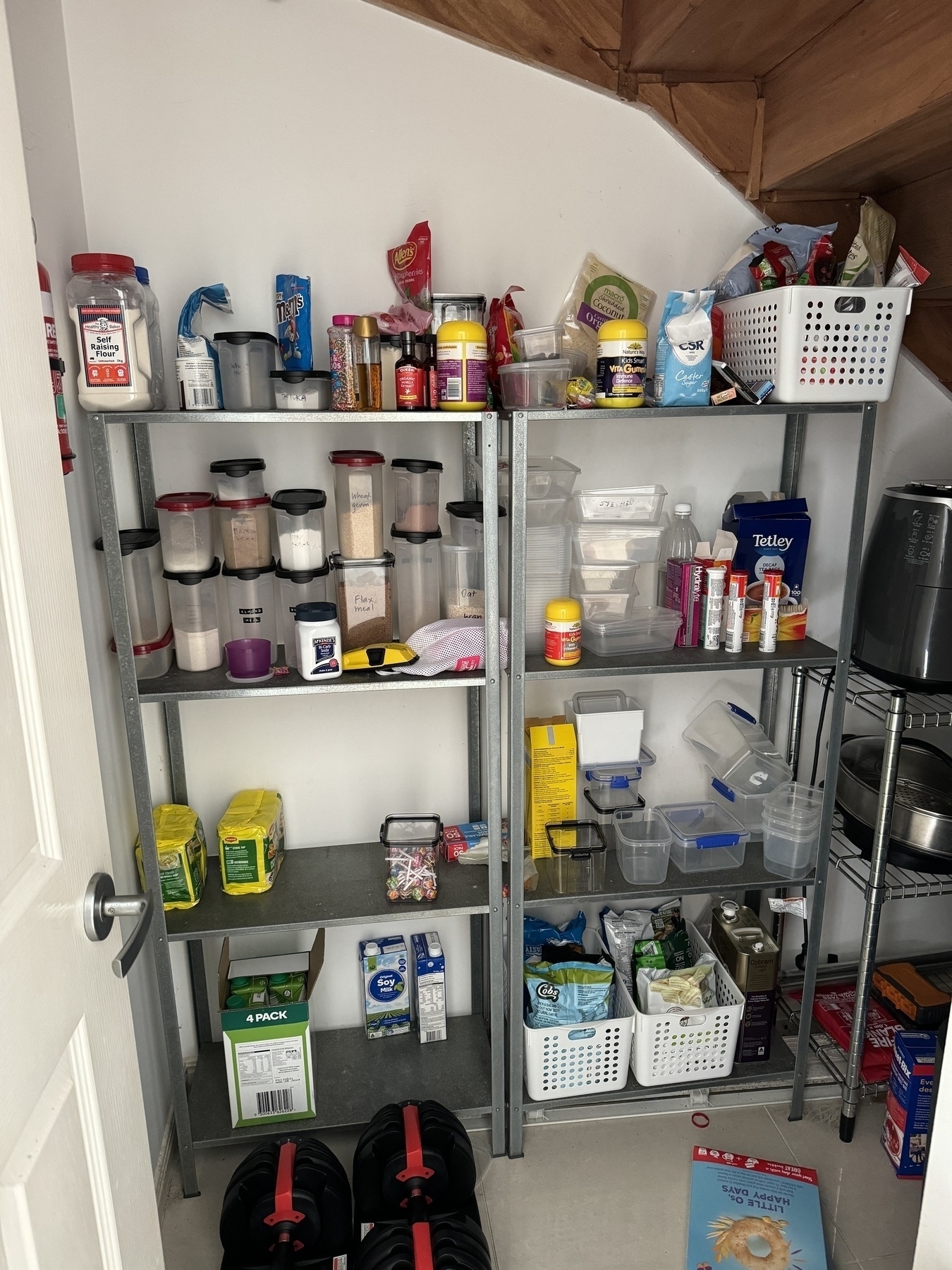 Some pantry shelves with assorted food items and containers